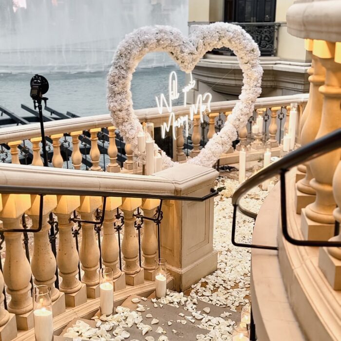 Romantic 'Will You Marry Me' Proposal with a White Rose Heart-Shaped Arch