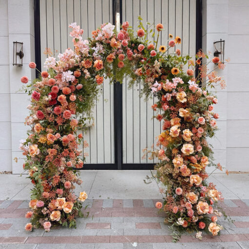 Rustic Boho Arch with Roses for a Unique Party Backdrop and Celebration