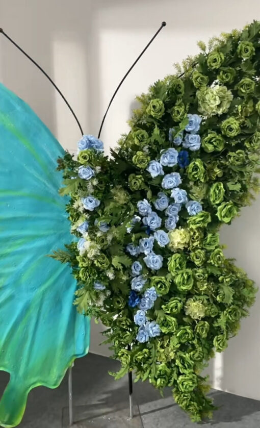 Serene Teal Butterfly Backdrop with Lush Green Roses for Luxury Event Decor