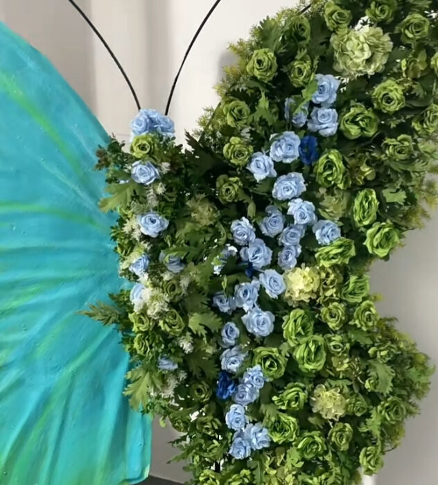 Serene Teal Butterfly Backdrop with Lush Green Roses for Luxury Event Decor
