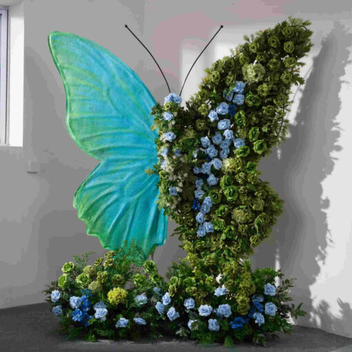 Serene Teal Butterfly Backdrop with Lush Green Roses for Luxury Event Decor