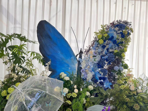 Sophisticated Butterfly Backdrop with Cool Tones and Blue Roses for Photo Booths