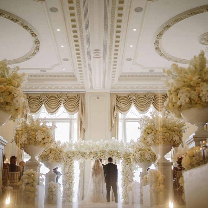 Sophisticated Luxury Wedding Decor: Greenery Arch with White Roses for a Perfect Wedding