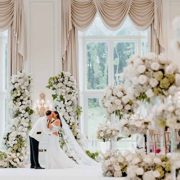 Sophisticated Luxury Wedding Decor: Greenery Arch with White Roses for a Perfect Wedding