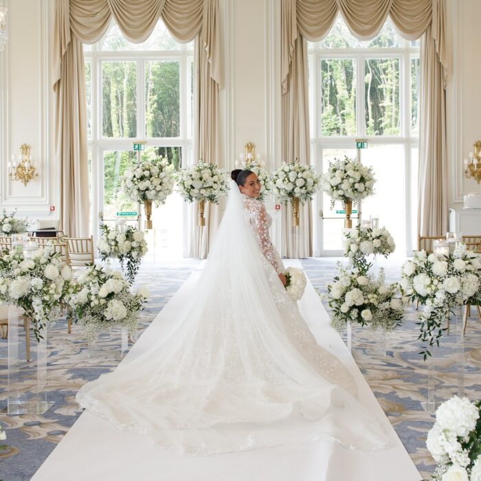 Sophisticated Luxury Wedding Decor: Greenery Arch with White Roses for a Perfect Wedding