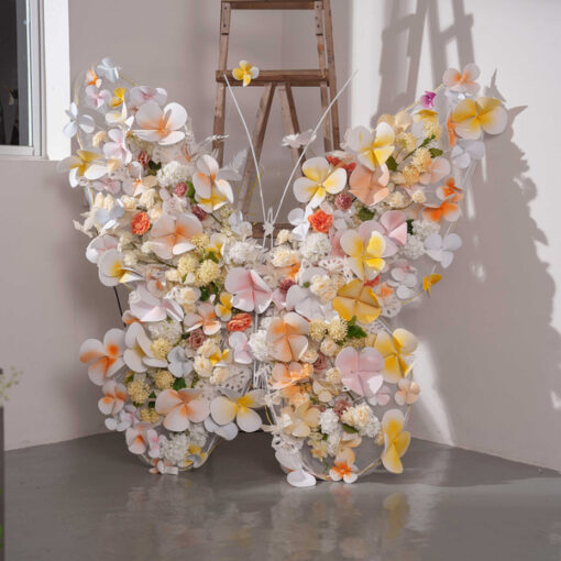Sophisticated Warm Tone Butterfly Backdrop with Artificial Flowers and LED Elements
