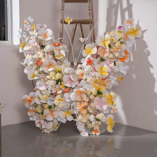Sophisticated Warm Tone Butterfly Backdrop with Artificial Flowers and LED Elements