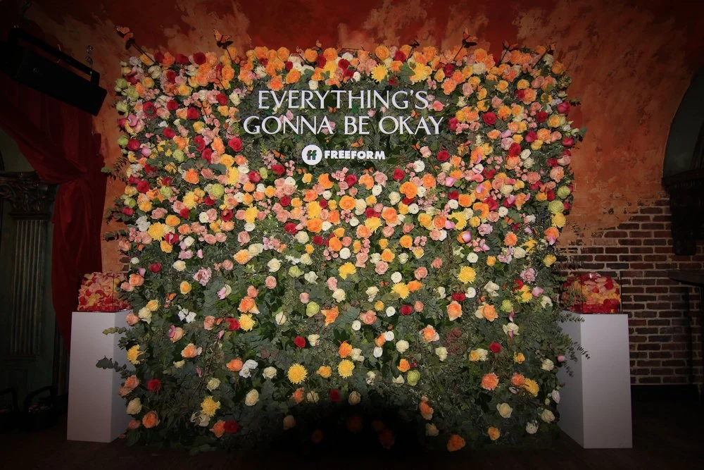 Add "Take a photo by the flower wall" to the game checklist
